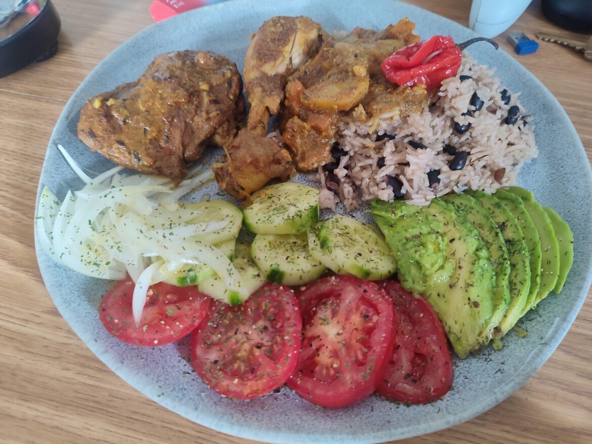 Trini style curry chicken w/ salad rice & peas.