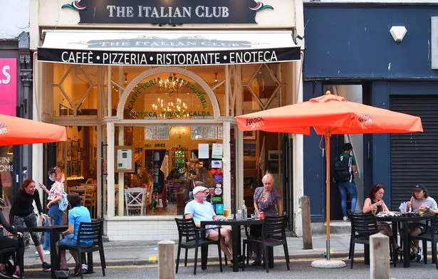 People eating outside The Italian Club on Bold Street