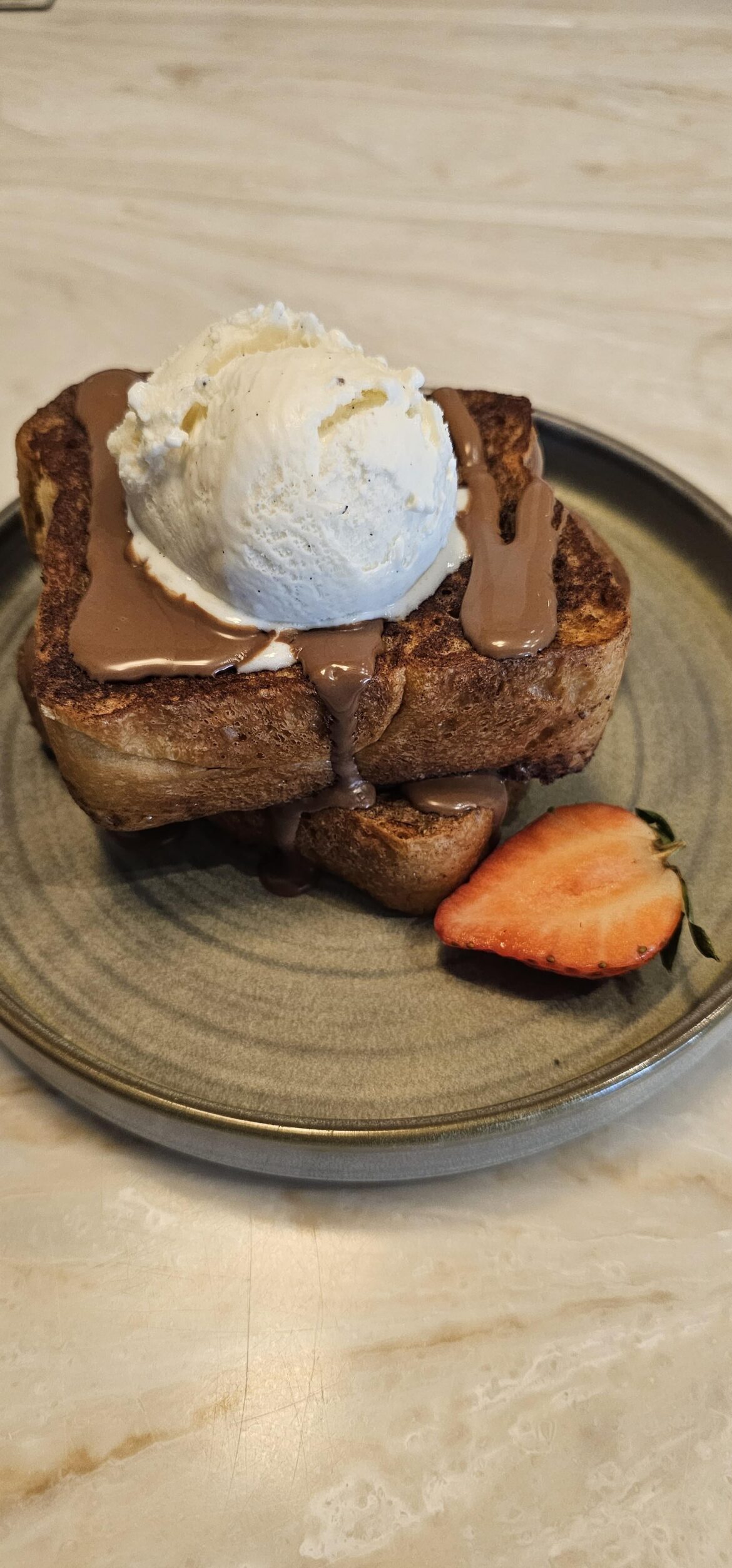 French toast with chocolate sauce and vanilla ice cream
