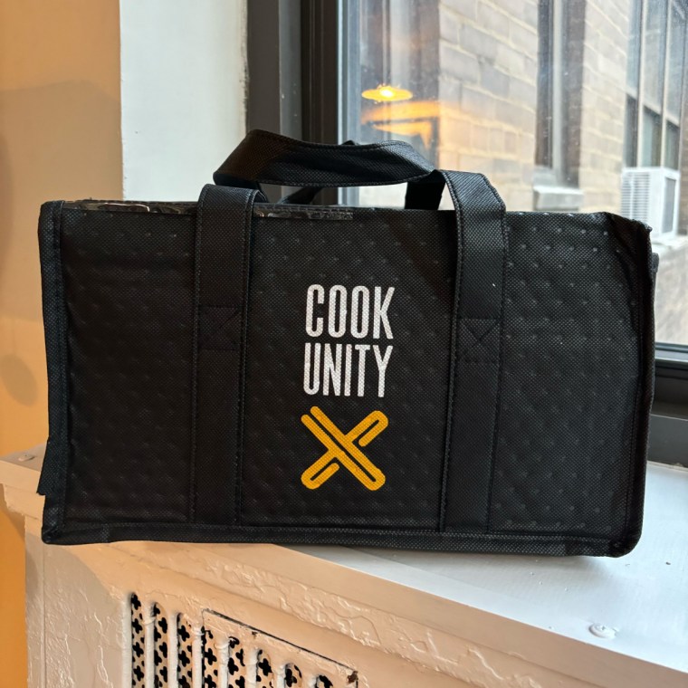 Cookunity black bag on a windowsill