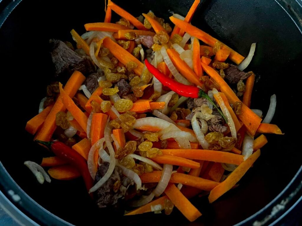 Festive pilaf in progress. With tomato salad.