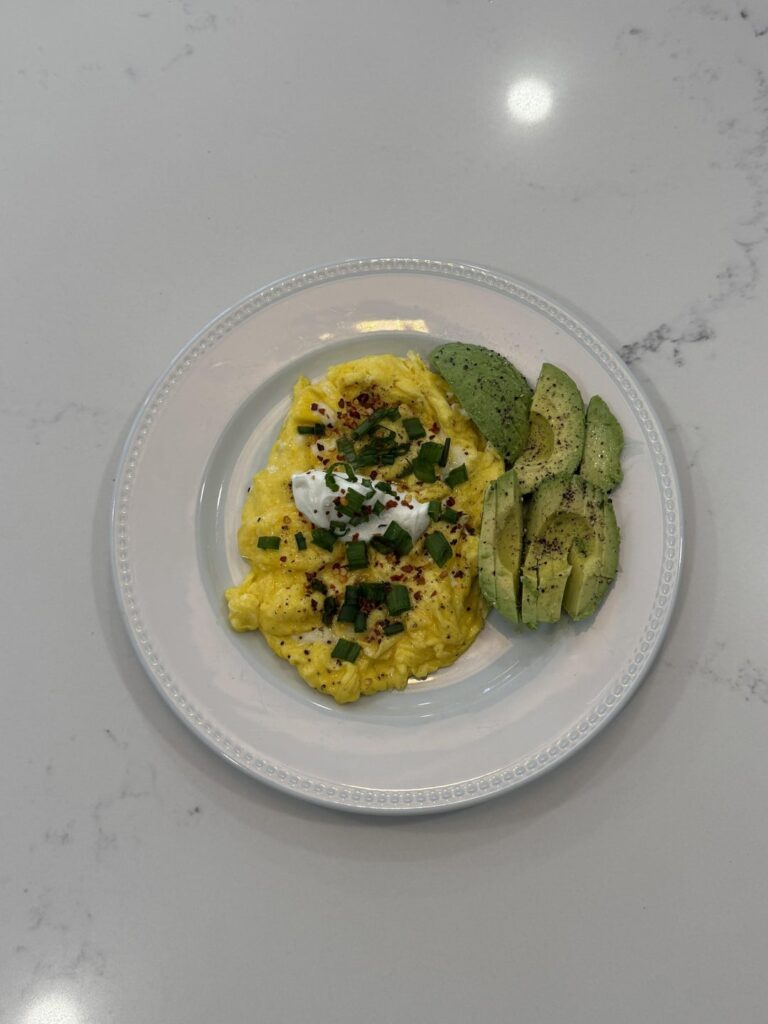 spicy scrambled eggs with avocado and sour cream