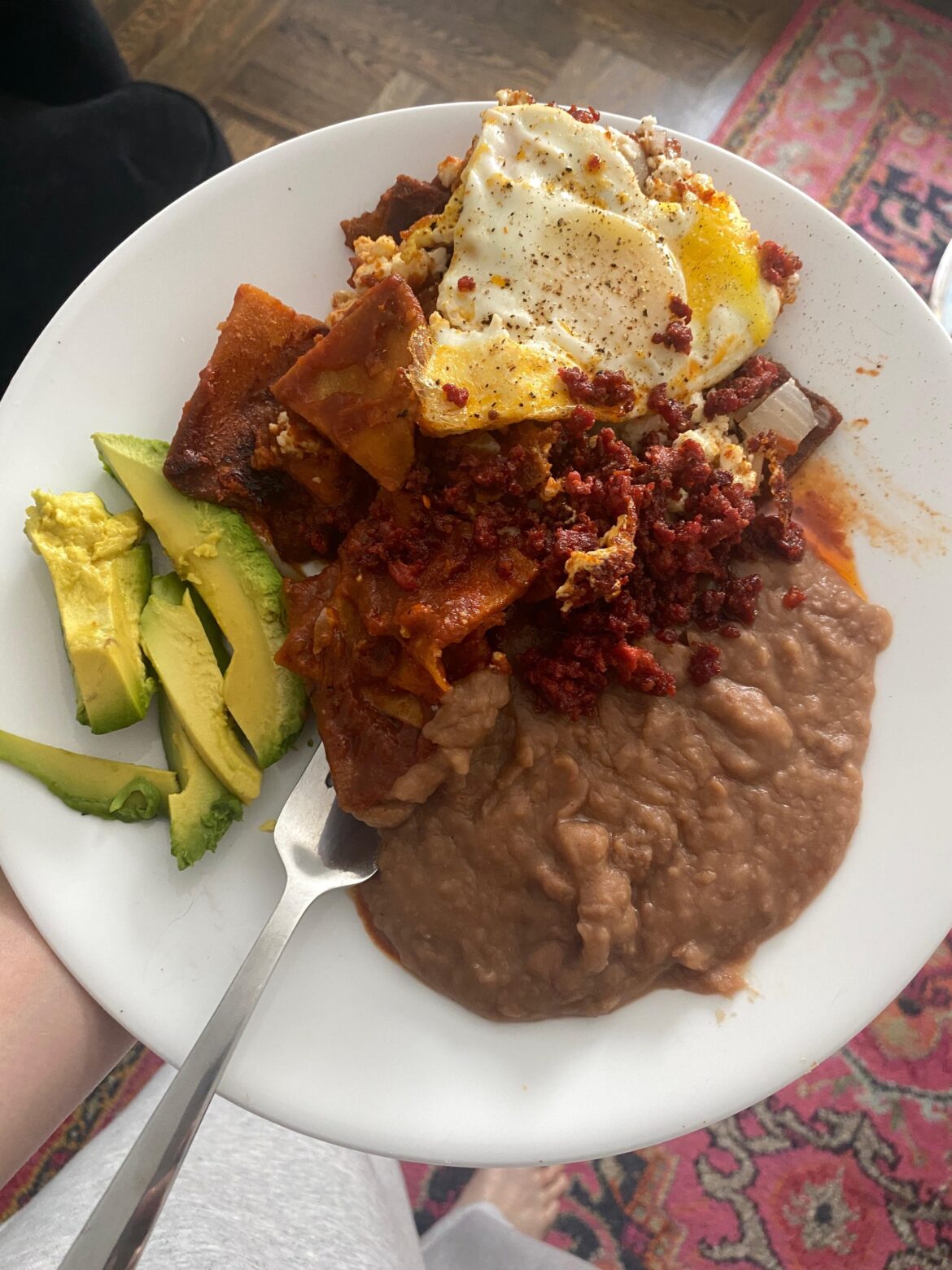 Diana Kennedy’s chilaquiles with beans, eggs, chorizo, avacado, and queso fresco