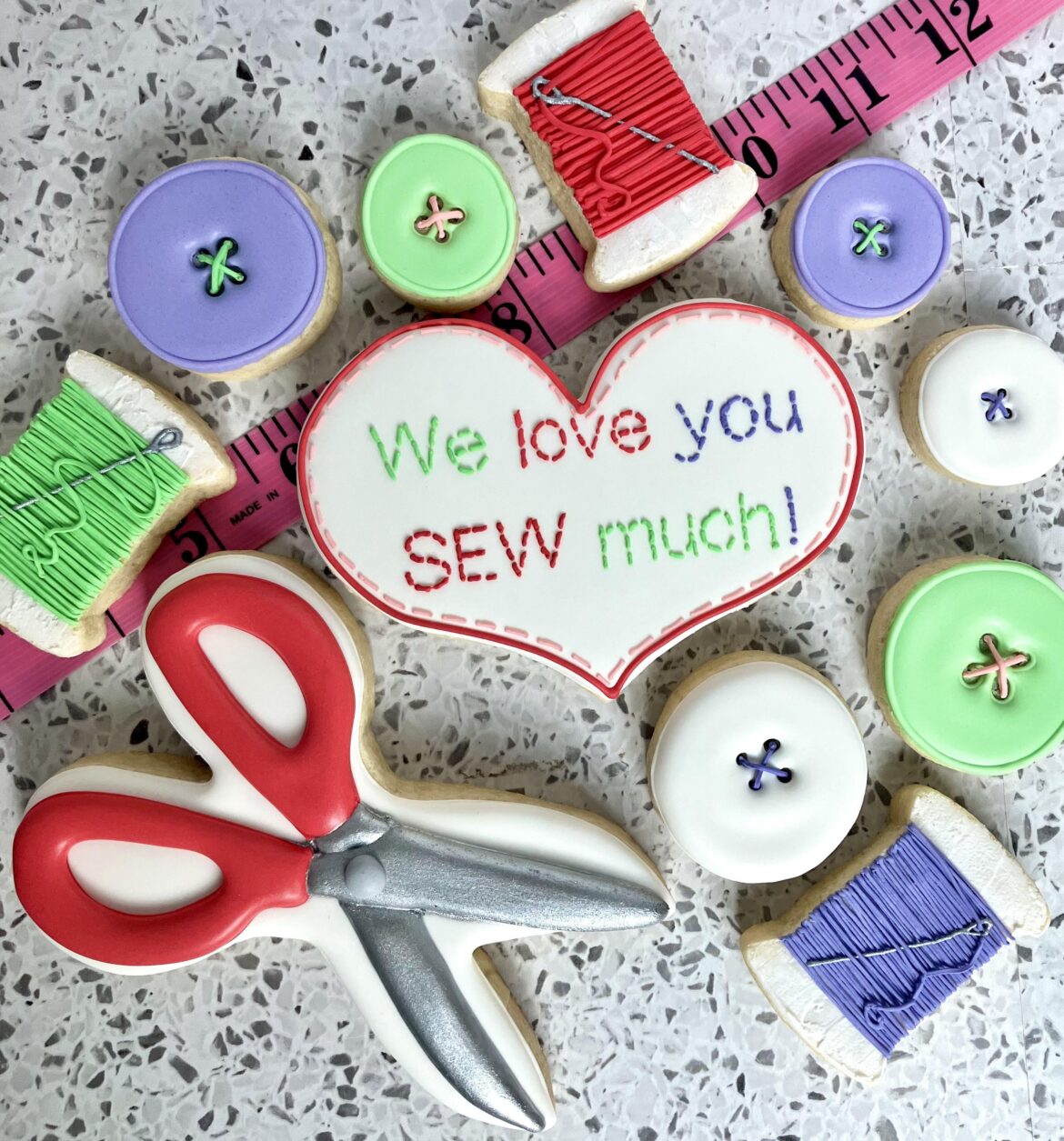 I make my mom a birthday cookie set every year for her birthday and drive it from MD to MI on our annual family vacation (we’re driving right now!) She’s a seamstress and we hope she loves these! 🧵 🪡