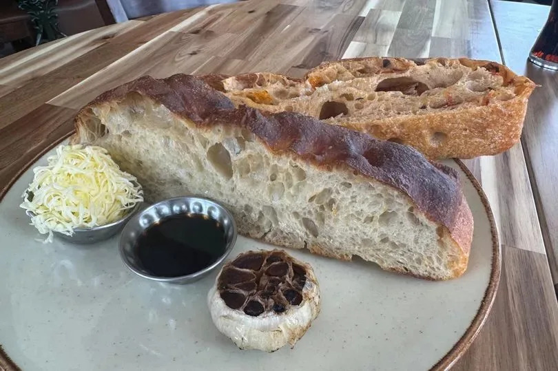 Focaccia with grated butter, balsamic and confit garlic  at the Carpenters Arms Italian Kitchen