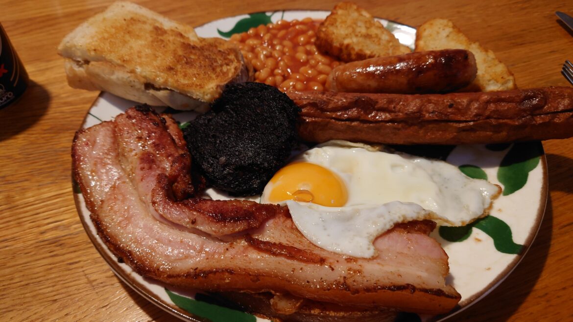 With thick bacon and sausage from the continent