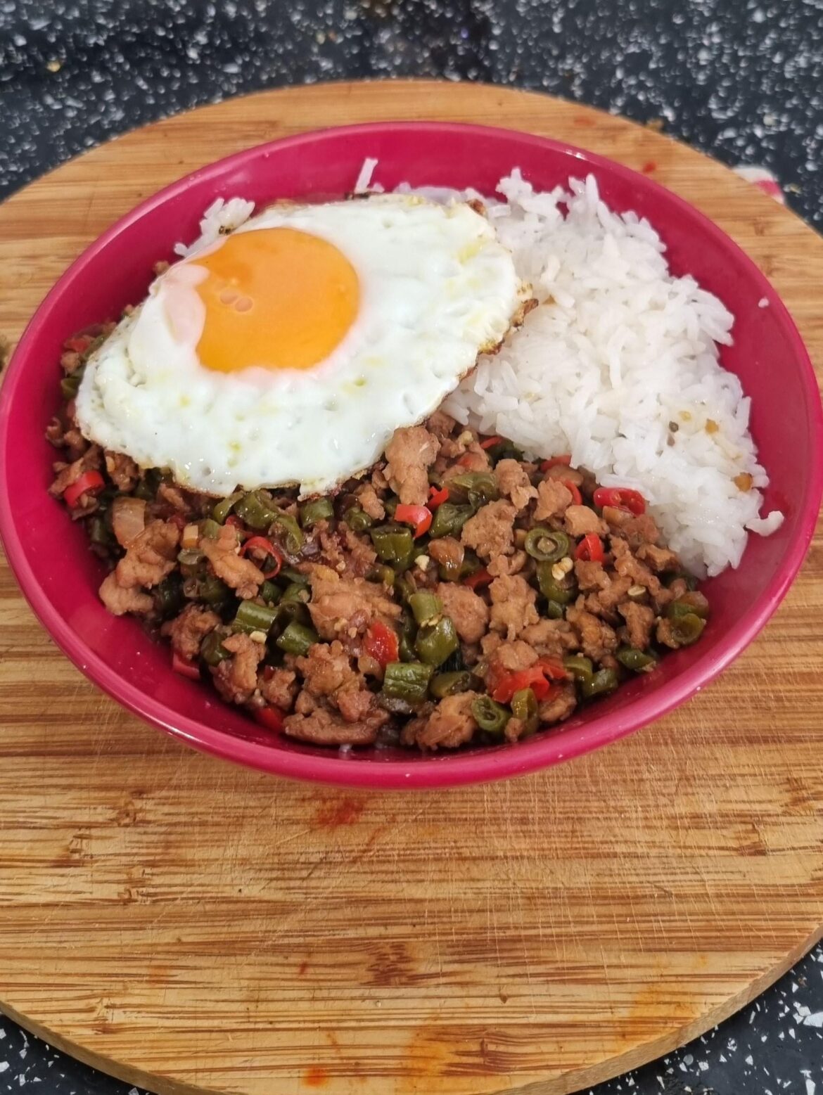 Thai holy basil stir fry (pad kaprow) with a fried egg