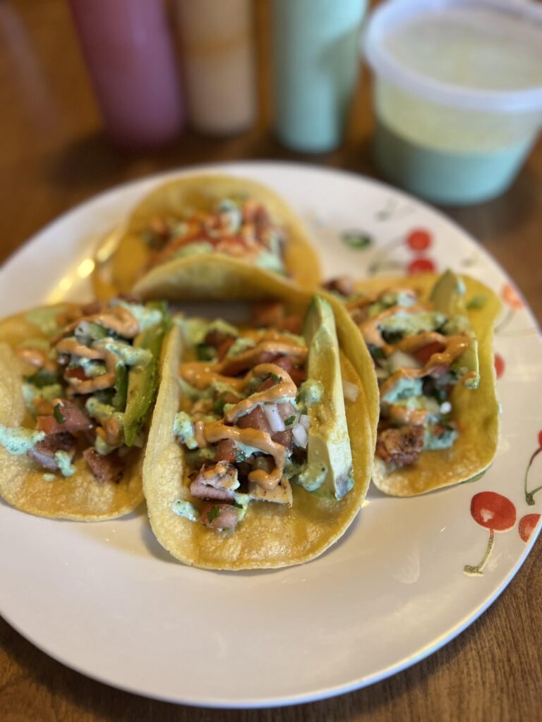 Tacos, pico, cilantro jalapeño sauce, chipotle sauce, avocado