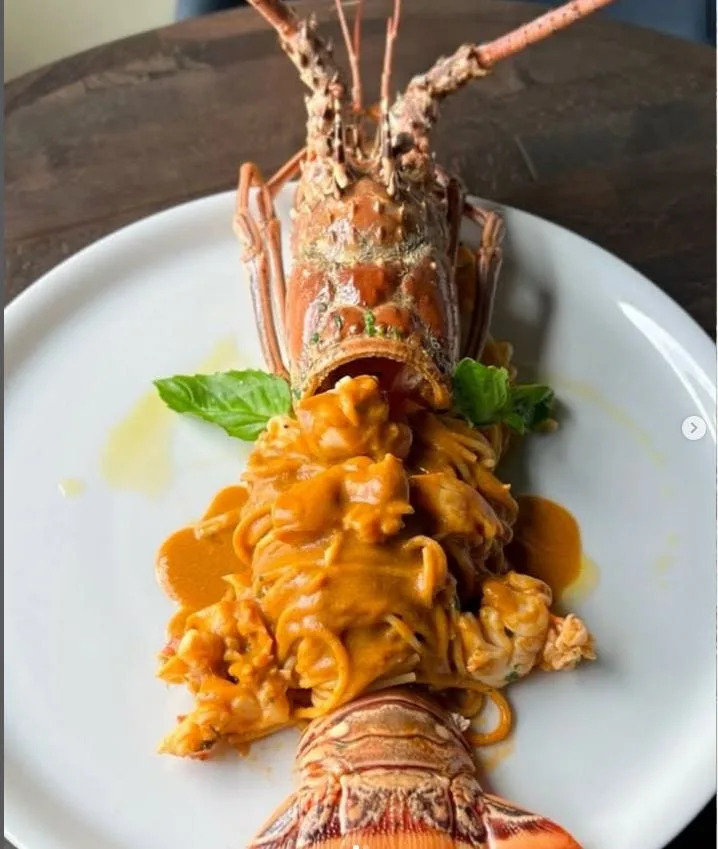 Florida lobster tail with lobster stock-infused sauce and spaghetti at Acqua Cafe in Palm Beach.