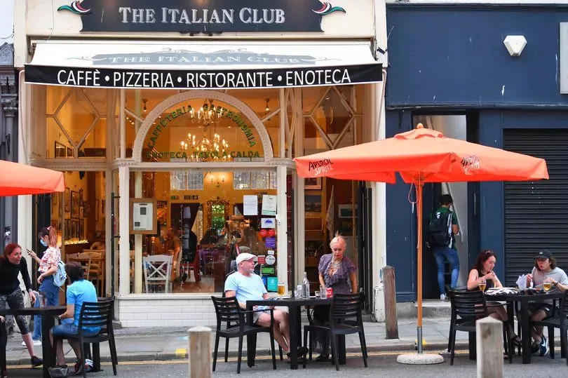 People eating outside The Italian Club on Bold Street