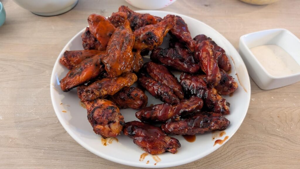 Homemade on the charcoal is infinitely better than anything else around. Buffalo on the left, BBQ on the right