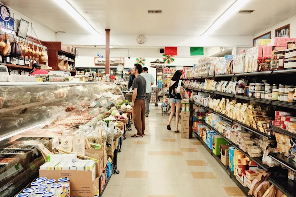 Shoppers peruse the shelves and the deli case at Monte Carlo Italian Deli in Burbank.