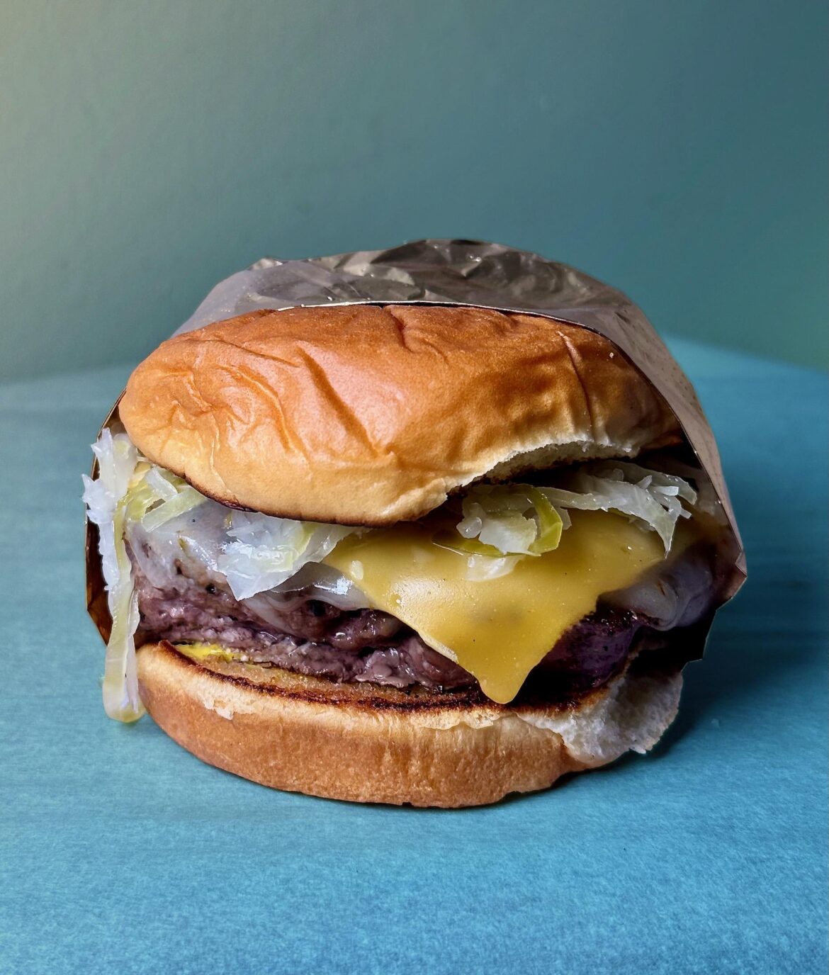 1/3lb, fresh kraut, pepper Jack, American, Hawaiian roll.