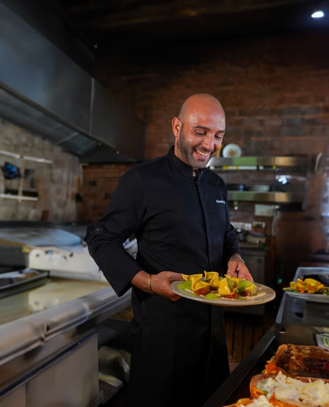 Chef Alessandro D’Amico presents one of his signature Italian creations, showcasing the artistry behind every dish.