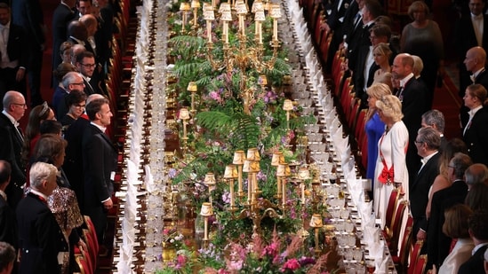Macron (Left side C), Britain's Queen Camilla (Right side C-R), French President's wife Brigitte Macron (Right side C) and Britain's Prince William, Prince of Wales (Right side C-L) attend a State Banquet at Windsor Castle.(AFP)