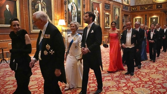 Lebanese-born Paris-based architect Lina Ghotmeh (L), Britain's Prince Richard, Duke of Gloucester (2L), Britain's Birgitte, Duchess of Gloucester (3L) and France's Tristan Bromet arrive to attend a State Banquet at Windsor Castle, west of London.(AFP)