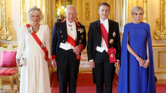 King Charles III, France's President Emmanuel Macron and his wife Brigitte Macron pose for a photo as they attend a State Banquet at Windsor Castle, west of London, on July 8, 2025, on the first day of a three-day state visit to by France's President Emmanuel Macron. French President Emmanuel Macron began a three-day state visit to Britain on Tuesday, which saw him address parliament and try to rekindle a purportedly warm relationship with King Charles III. (Photo by Chris Jackson / POOL / AFP)(AFP)