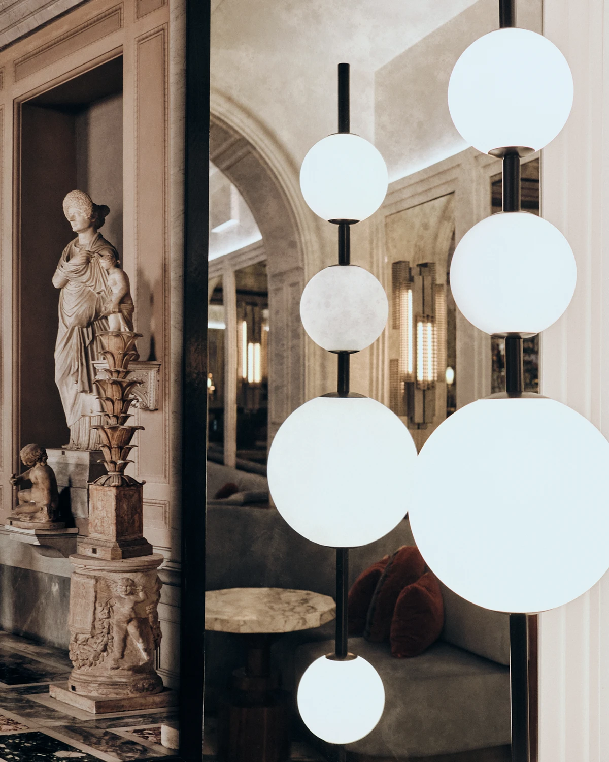 Classical sculpture and modern lighting in the halls of W Rome