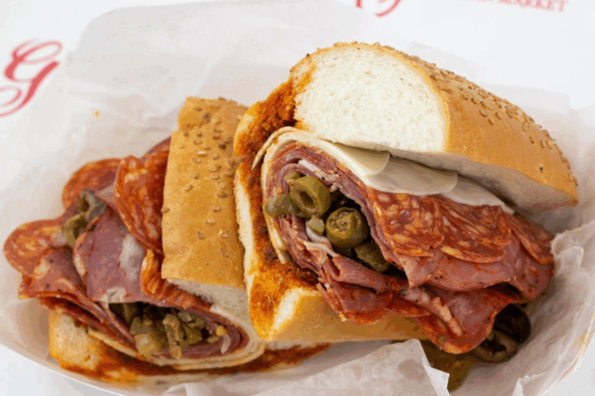 Big Sky Twin Drive-In at dusk with movie playing