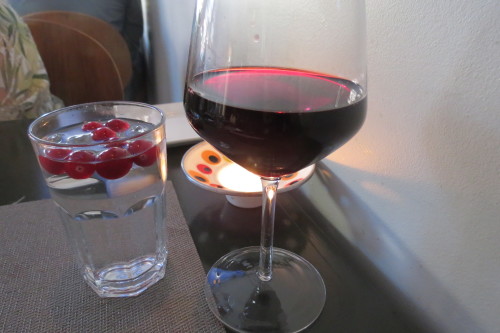 Enjoying a glass of Merlot at Batifole Restaurant