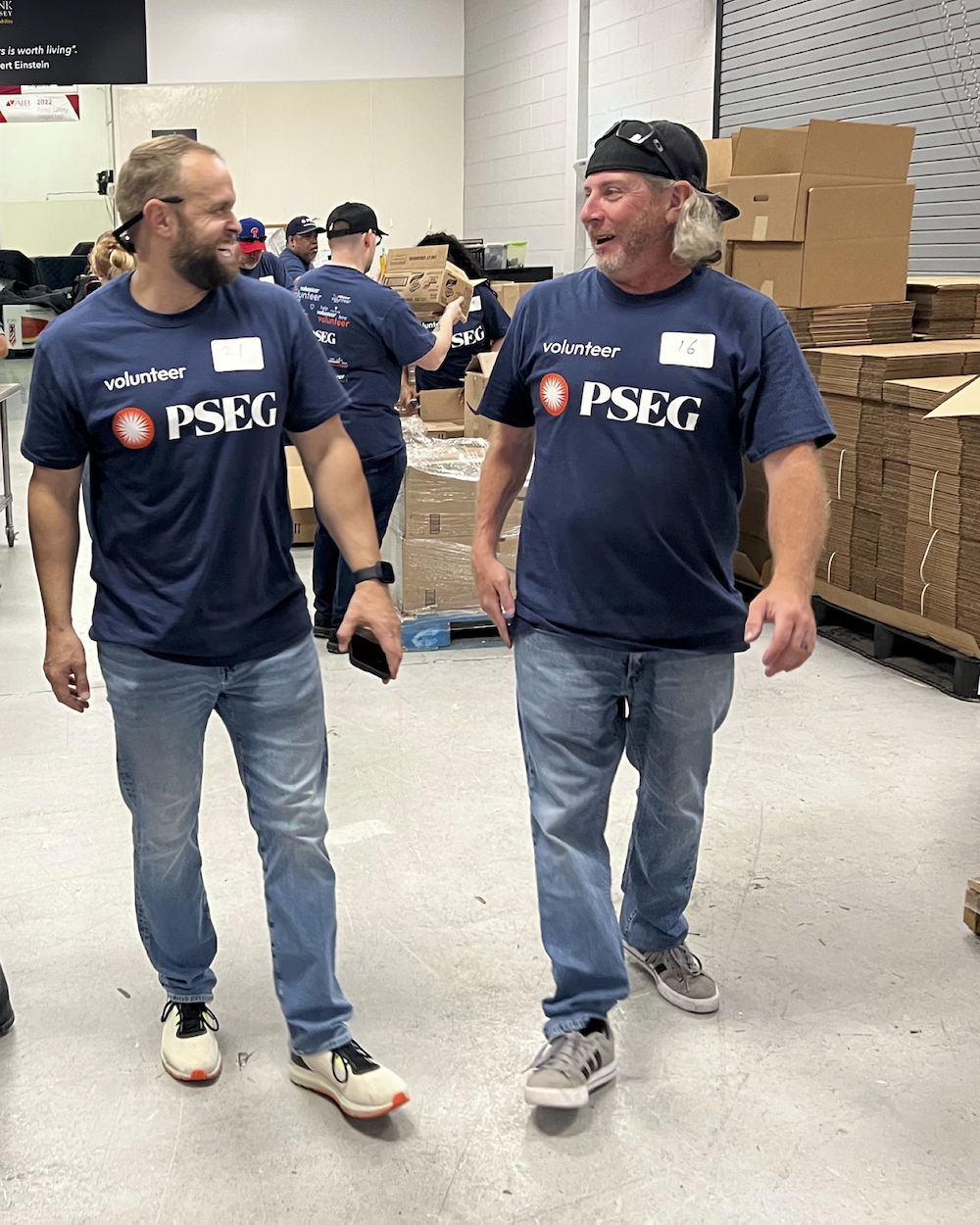 Two volunteers speaking to each other