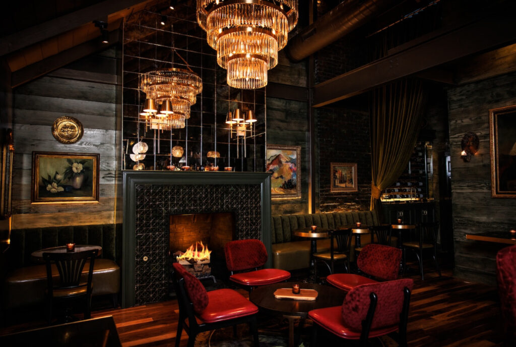 Image shows the elegant and moody interior of Cache cocktail lounge in Dallas