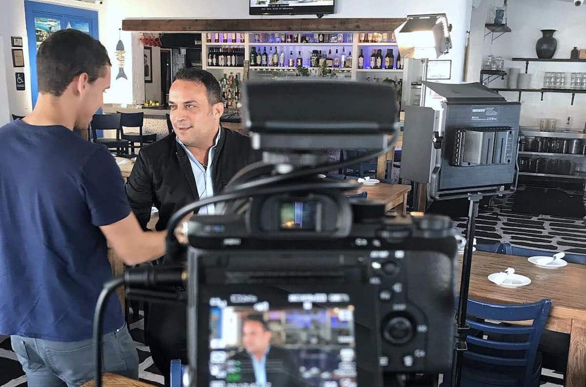 George Merlemis talking about Greek foods in the US at his Opa taverna in Florida