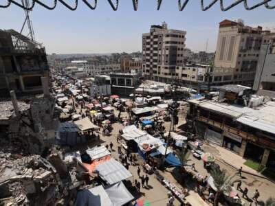 Palestinians gather at a market at the Nuseirat refugee camp in the central Gaza Strip, on May 10, 2025.
