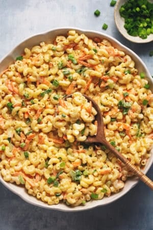 creamy hawaiian mac salad in bowl with wooden serving spoon