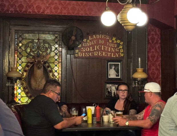 Among the vintage signs inside Cole's French Dip: "Ladies, Kindly Do Your Soliciting Discreetly." The restaurant and bar, in a building that was once the terminus for L.A.'s Red Car trolleys, is due to close in mid-Sept.. (Photo by David Allen, Inland Valley Daily Bulletin/SCNG)