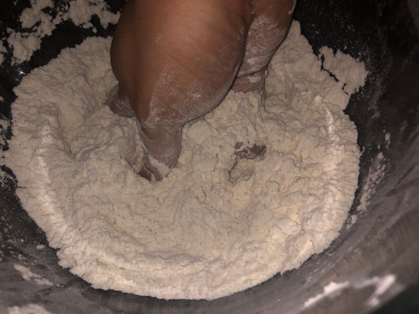 Cooking Eorzea | Mixing the dry ingredients by hand.