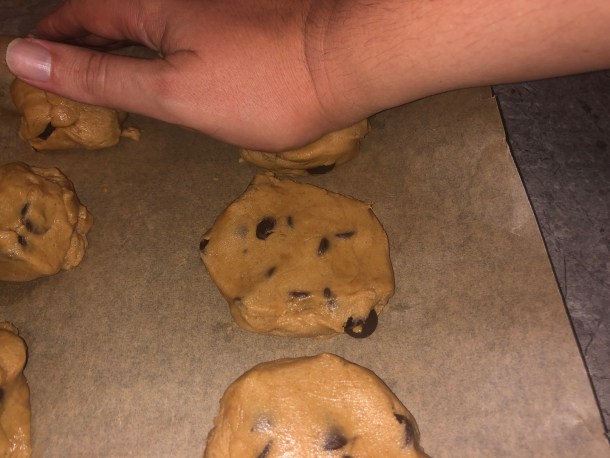 Flattening out the dough.