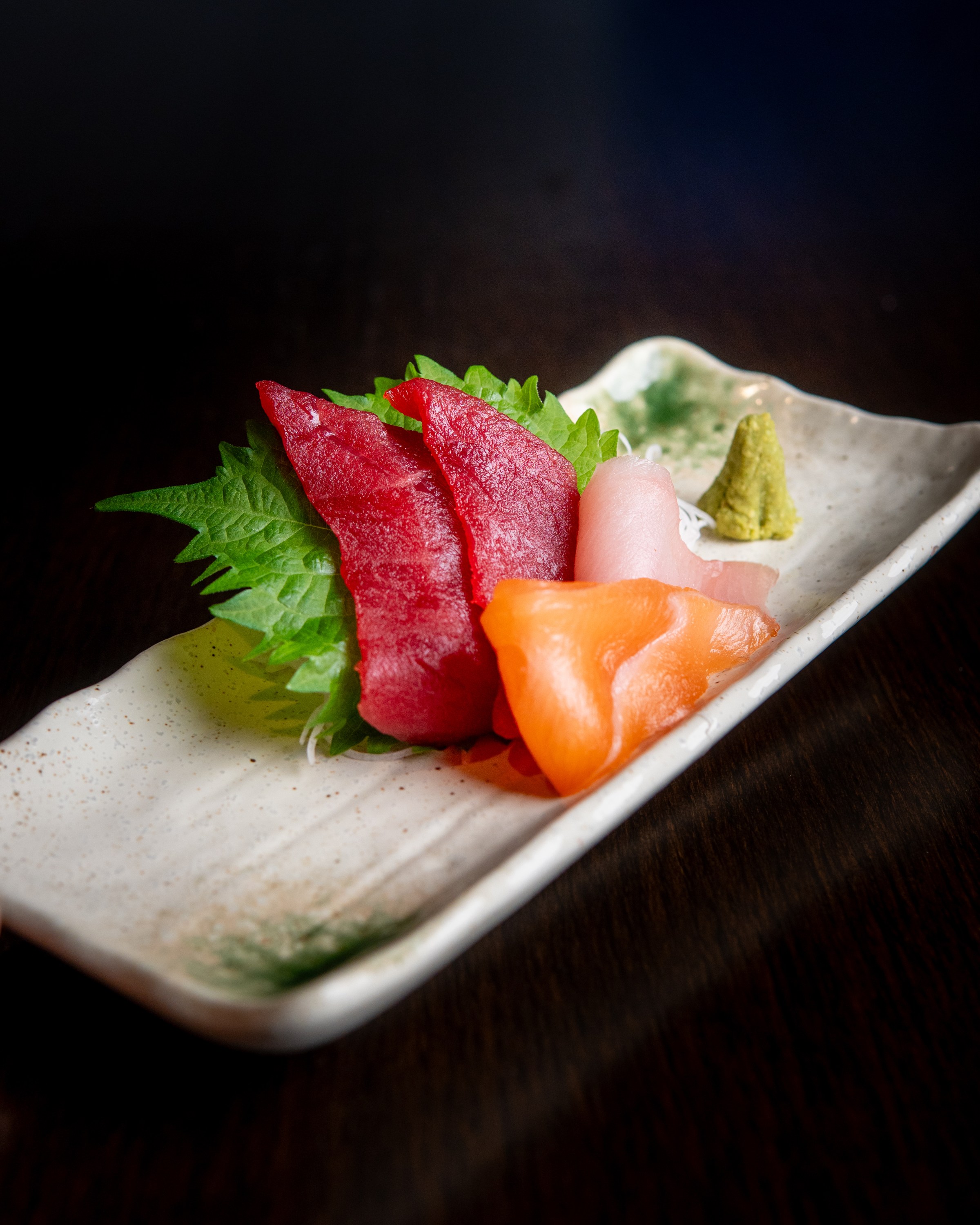 Tuna and salmon sashimi on a white plate from Sushi Zanmai