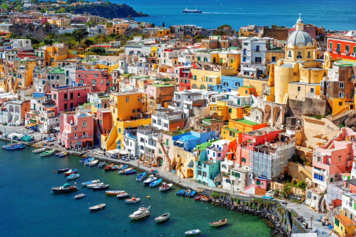 Italy’s Postcard Island: Enjoy No Crowds & Secret Shores On Your Next Italian Getaway Pastel townscape of Procida, Italy