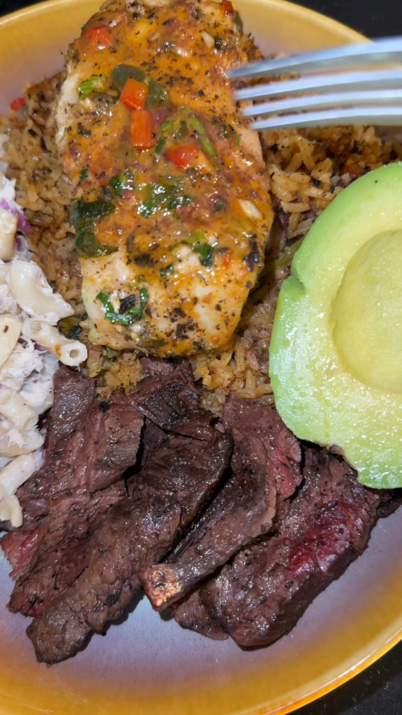 Melt in your mouth coconut Chilean seabass, skirt steak, rice, macaroni salad and avocado.