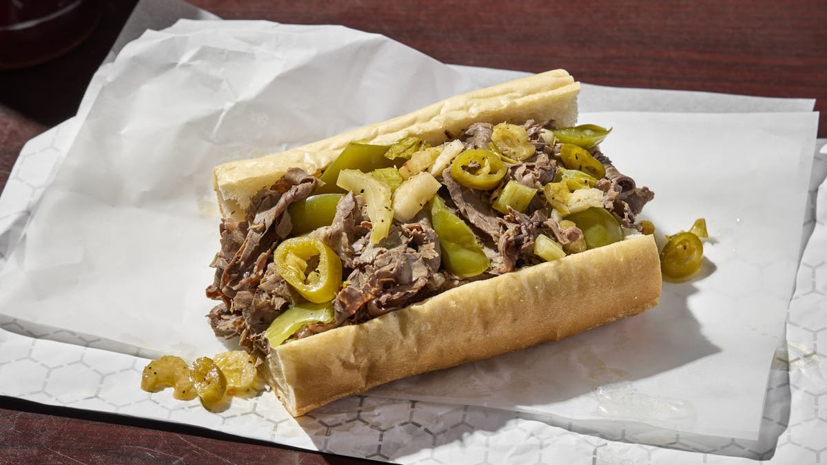 An Italian beef sandwich from Chicago's Mr. Beef is waiting to be eaten.
