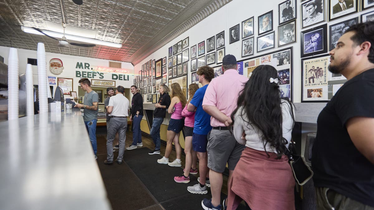 Patrons wait in line inside Chicago's Mr. Beef.