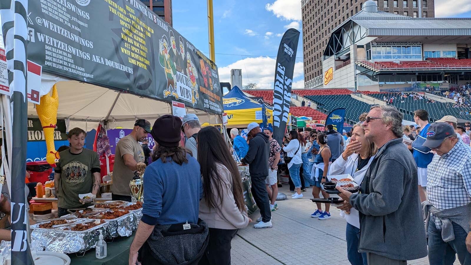 Festival goers survey the options at Double Dub's. The Laramie-based food truck has returned to the festival for the sixth year.