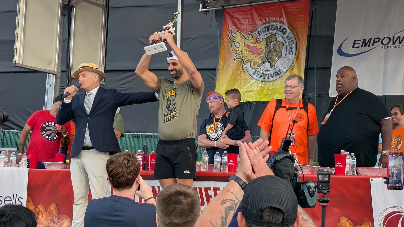 James Webb of Australia was the first to finish about 13 pounds of food in the "Buffalo Buffett Bowl," a major league eating competition.