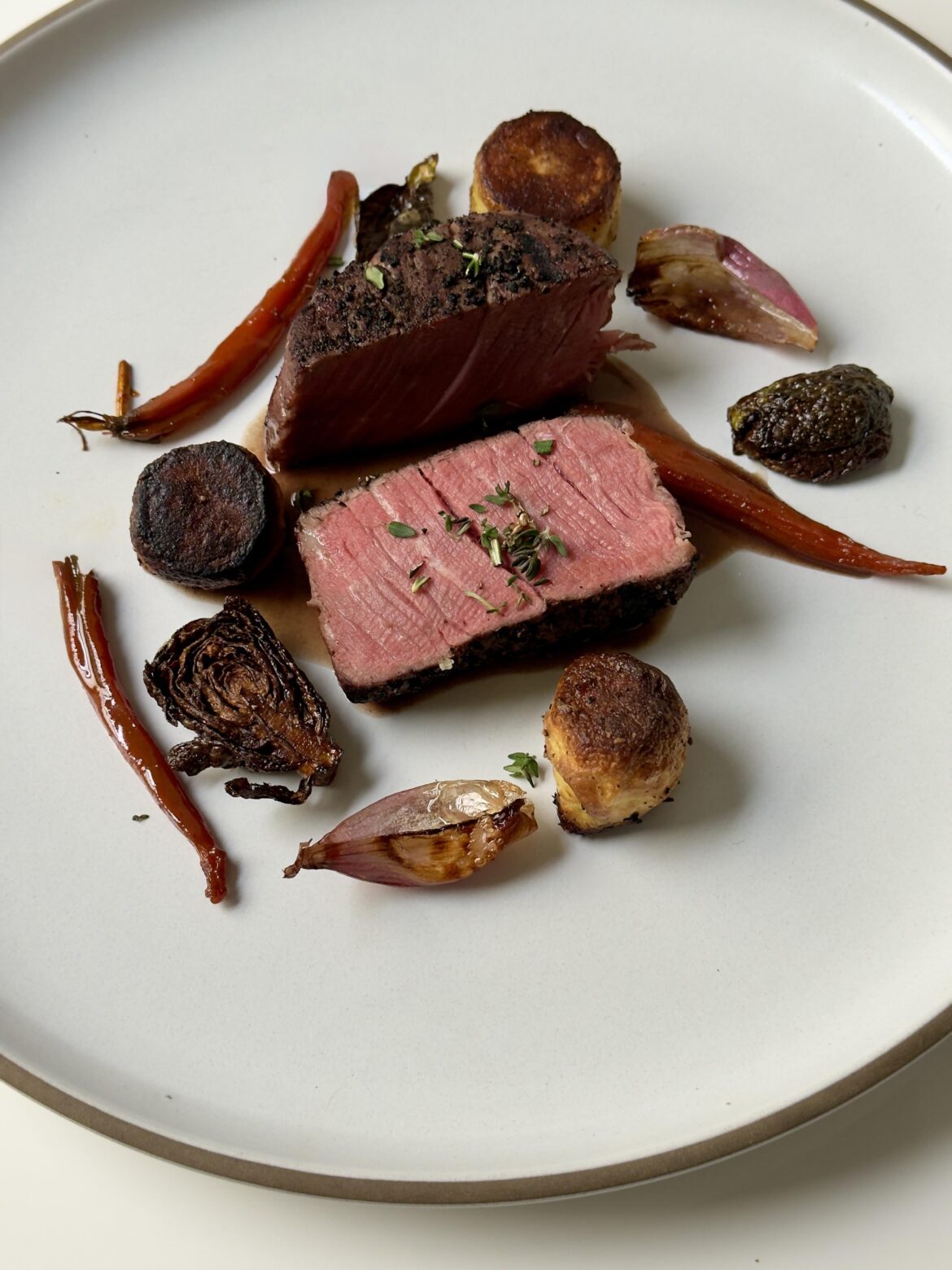 Filet, red wine reduction, fondant potatoes, smoked rehydrated carrots, fried brussels and shallots