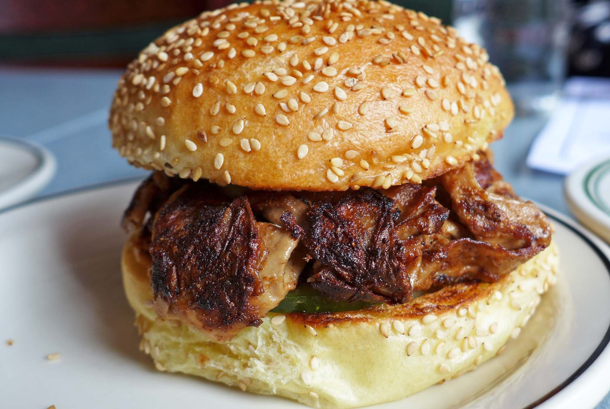 A hamburger looking sandwich.