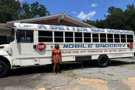 In 2017, Tiffany Terrell replaced school bus seats with shelves stocked with fruits, vegetables, meats, and eggs and drove around her mobile grocery store to senior communities, public housing developments, and rural areas. (Renuka Rayasam/KFF Health News)