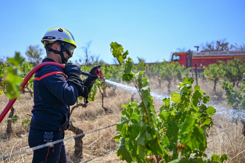 On Thursday, around 2,000 firefighters battled to control a blaze that has burned an area bigger than Paris. Photograph: Philippe Magoni/ EPA