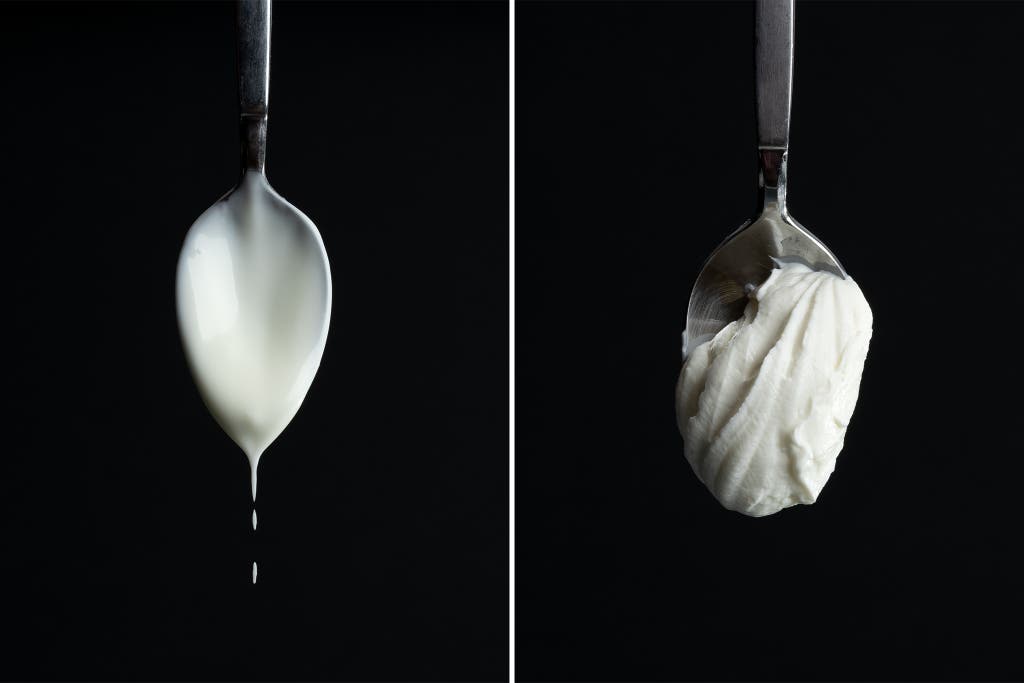 Two side by side photos of yogurt on a spoon, the first one of runny, liquidy yogurt, the second one of more creamy, solid yogurt.
