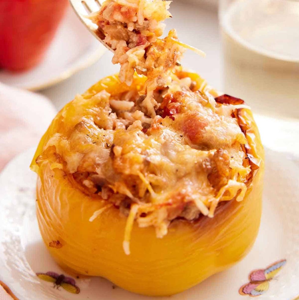 stuffed bell pepper with rice and cheese served with a drink