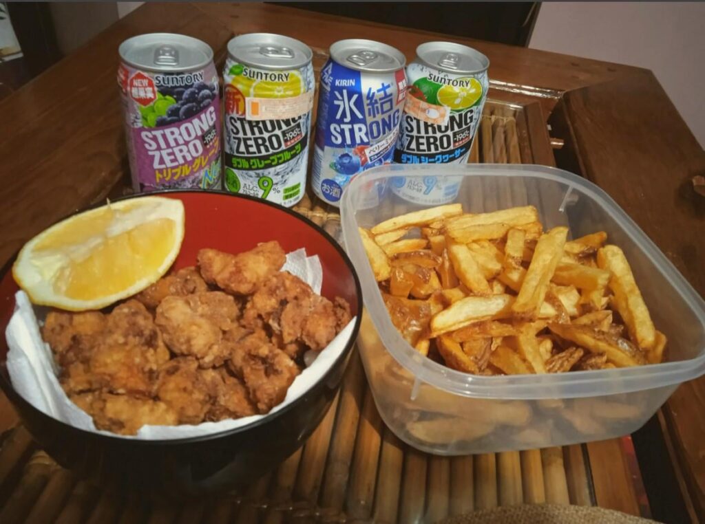 Birthday vibes: huge bowl of karaage, fries, and 4 cans of Strong Zero.