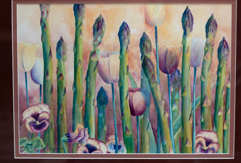 A watercolor by Jan Roberts-Dominguez of asparagus and flowers.