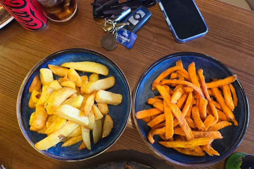 The enormous size portions of garlic chips and sweet potato fries