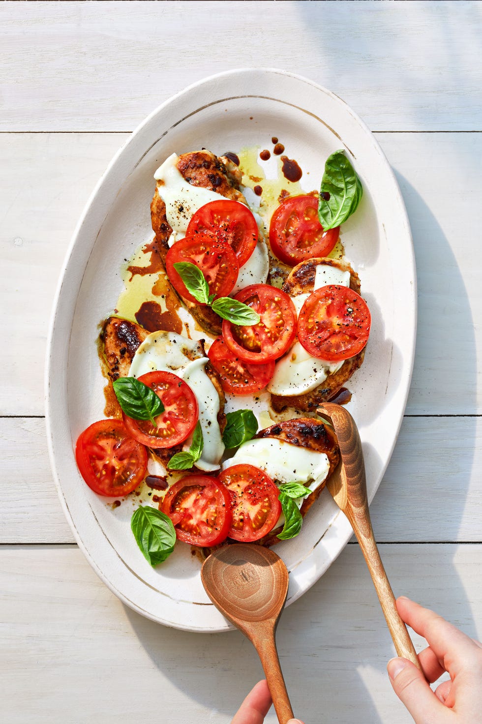 balsamic chicken caprese on a white plate