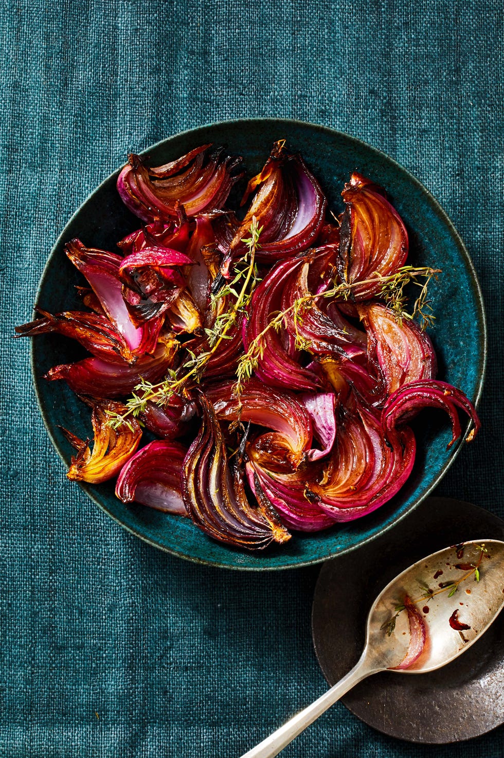 balsamic roasted red onions in a blue bowl